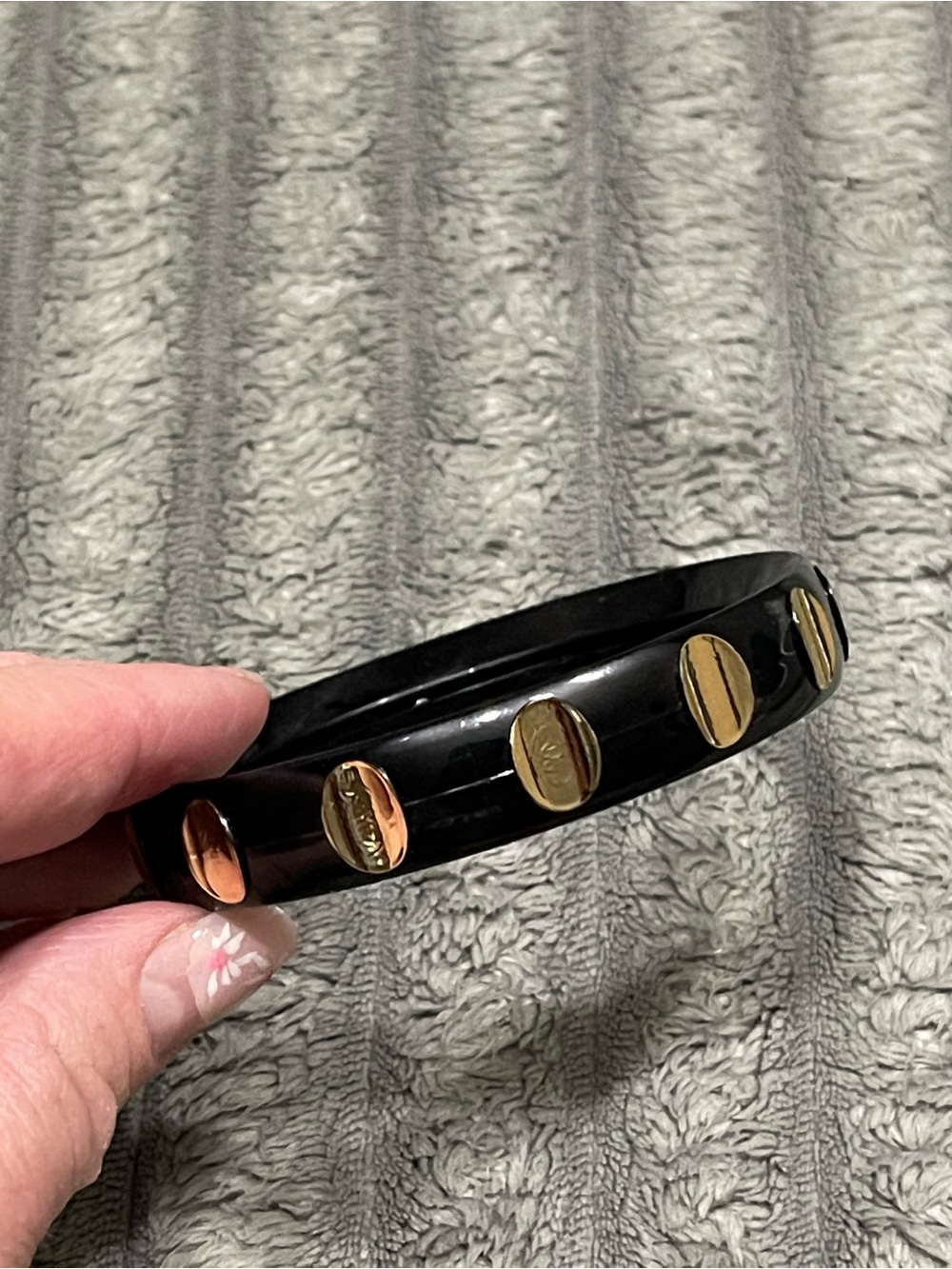 Black bracelet with gold accents